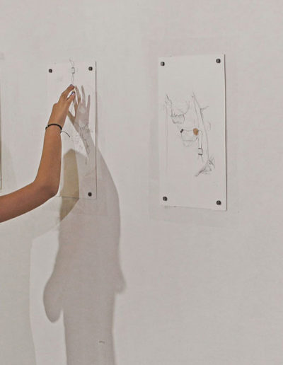 A girl touches electronic drawings in Greece